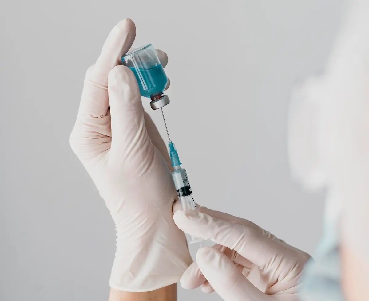 doctor-holding-syringe-vaccine.webp